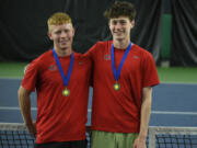 Tommy James (left) and Aiden Brasier of Camas pose for a photo after winning the boys doubles state title at the 4A state tennis tournament at The Pacific Clinic in Kennewick on Saturday, May 25, 2024.