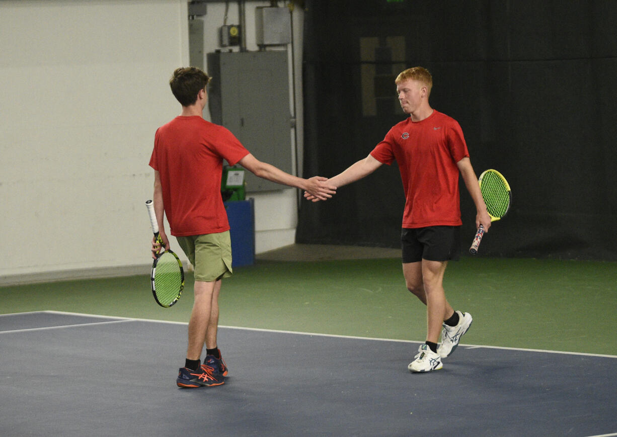 Tommy James (right) and Aiden Brasier of Camas congratulate each other after a point during the boys doubles championship match at the 4A state tennis tournament at The Pacific Clinic in Kennewick on Saturday, May 25, 2024.