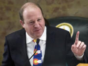 FILE - Colorado Gov. Jared Polis in the House of Representatives chamber in the State Capitol, Jan. 17, 2023, in Denver. State lawmakers&rsquo; first attempts at curtailing discrimination in artificial intelligence programs that play a hidden role American&rsquo;s lives are floundering across the country. Only Colorado&rsquo;s bill has been signed by the governor Polis.