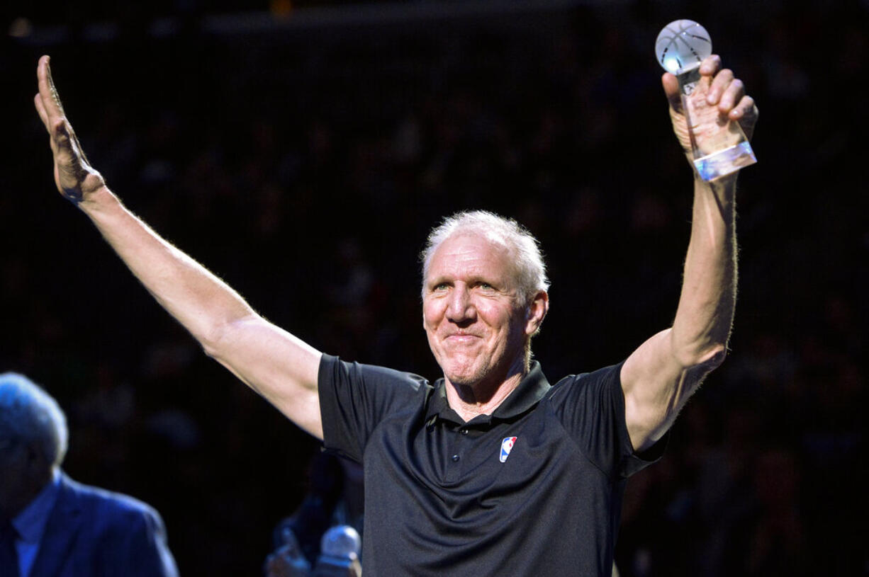 Bill Walton raises his hands as he stands with fellow recipients of the annual National Civil Rights Museum Sports Legacy Award before the annual Martin Luther King Jr. Celebration Game between the New Orleans Pelicans and the Memphis Grizzlies Monday, Jan. 21, 2019, in Memphis, Tenn. Wayne Embry, Candace Parker, and Chris Bosh were also honored.