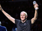 Bill Walton raises his hands as he stands with fellow recipients of the annual National Civil Rights Museum Sports Legacy Award before the annual Martin Luther King Jr. Celebration Game between the New Orleans Pelicans and the Memphis Grizzlies Monday, Jan. 21, 2019, in Memphis, Tenn. Wayne Embry, Candace Parker, and Chris Bosh were also honored.