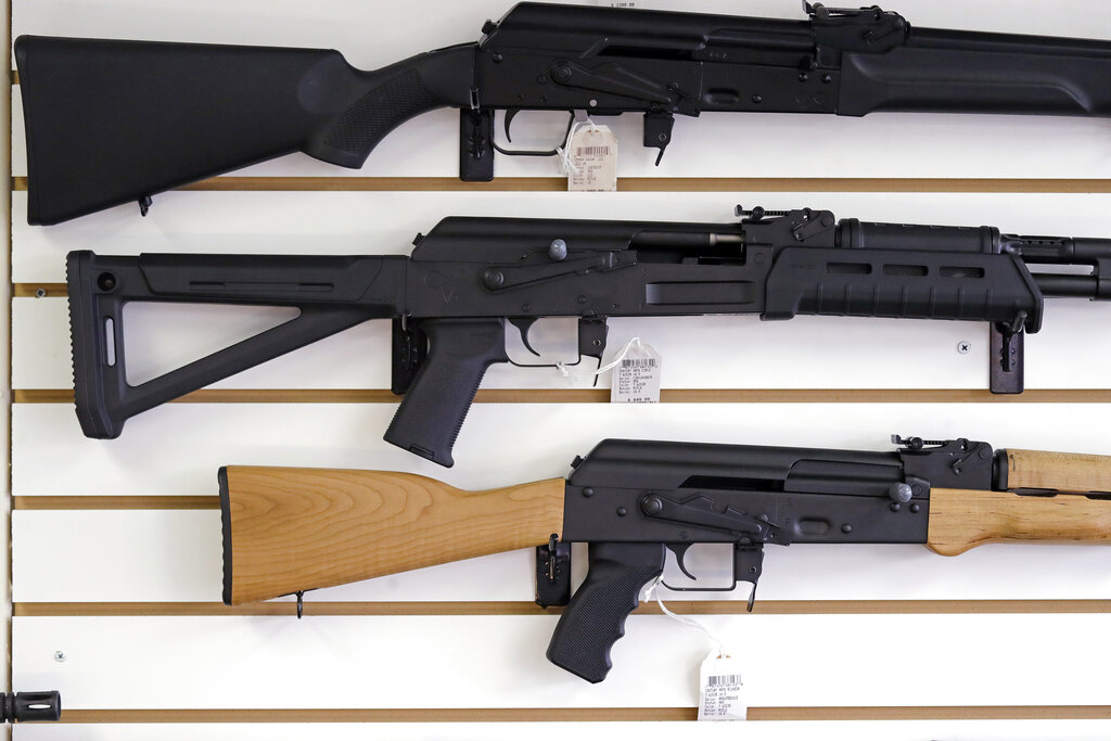 Semi-automatic rifles are displayed on a wall at a gun shop in Lynnwood.