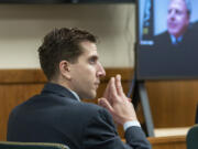 FILE - Bryan Kohberger listens to arguments during a hearing, Oct. 26, 2023, in Moscow, Idaho. Late Friday, Dec. 15, a judge ruled that the grand jury indictment of Kohberger, who is charged with killing four University of Idaho students, was conducted properly and will stand.