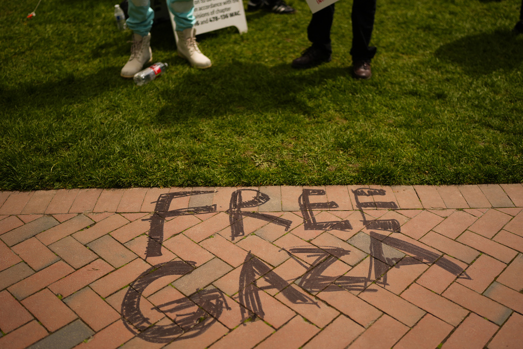 "Free Gaza" is written on the path in front of a pro-Palestinian encampment at the University of Washington campus Monday, April 29, 2024, in Seattle. The group is demanding that the university divest from Israel and cut ties with Boeing, which manufactures products used by Israel Defense Forces.