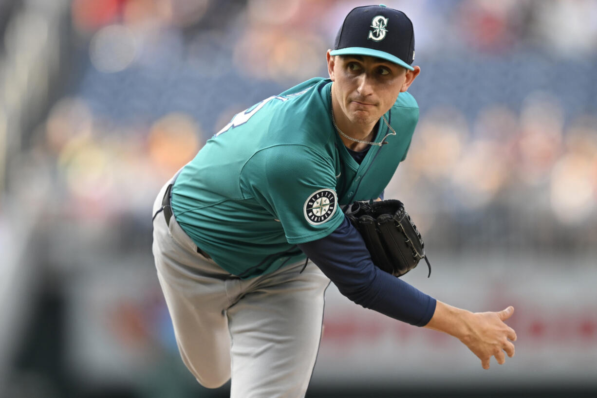 Seattle Mariners starting pitcher George Kirby follows through during the first inning of a baseball game against the Washington Nationals, Friday, May 24, 2024, in Washington.