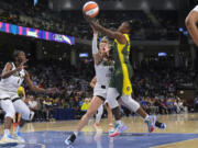 Chicago Sky guard Marina Mabrey, left, fouls Seattle Storm guard Jewell Loyd during the first half of a WNBA basketball game Tuesday, May 28, 2024, in Chicago.