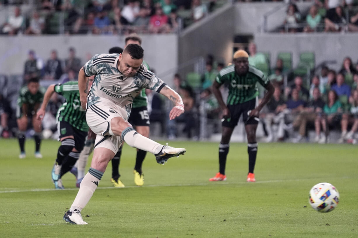 Portland Timbers forward Jonathan Rodríguez (14) scores against Austin FC during the second half of an MLS soccer match in Austin, Texas, Wednesday, May 29, 2024.