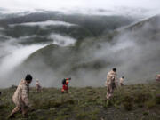 In this photo provided by Moj News Agency, rescue team members search for the wreckage of the helicopter carrying Iranian President Ebrahim Raisi after it crashed in Varzaghan in northwestern Iran, Monday, May 20, 2024. Raisi, the country&rsquo;s foreign minister and several other officials were found dead on Monday, hours after their helicopter crashed in a foggy, mountainous region of the country&rsquo;s northwest, state media reported.