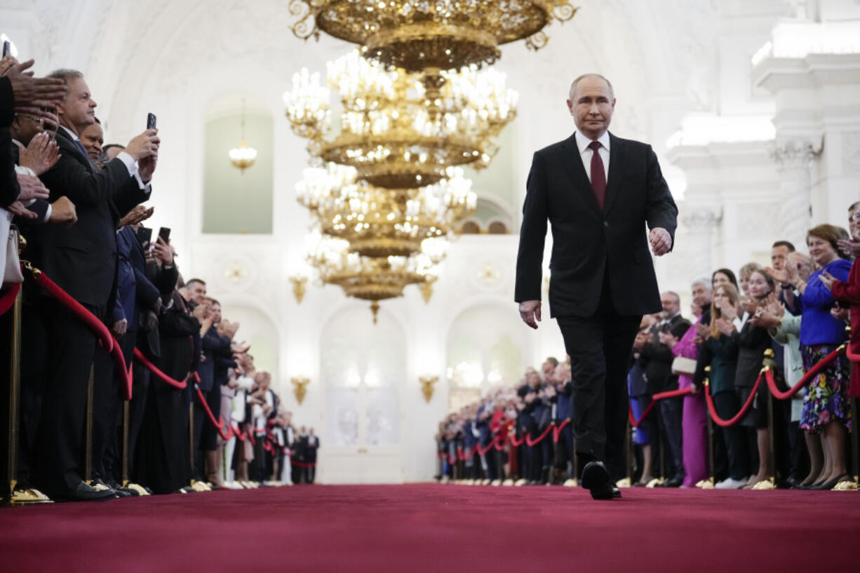 Vladimir Putin walks to take his oath as Russian president during an inauguration ceremony in the Grand Kremlin Palace in Moscow, Russia, Tuesday, May 7, 2024.