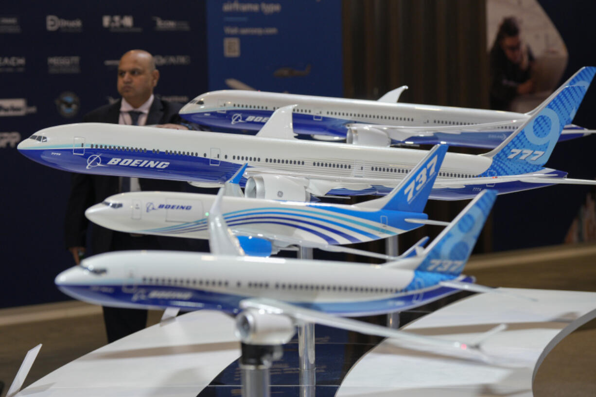 FILE - Models of Boeing aircraft are displayed during the Singapore Airshow in Singapore, Feb. 22, 2024. In the latest round of their decades-long battle for dominance in commercial aircraft, Europe&rsquo;s Airbus has established a clear sales lead over Boeing as the American company deals with the fallout from manufacturing troubles and ongoing safety concerns.