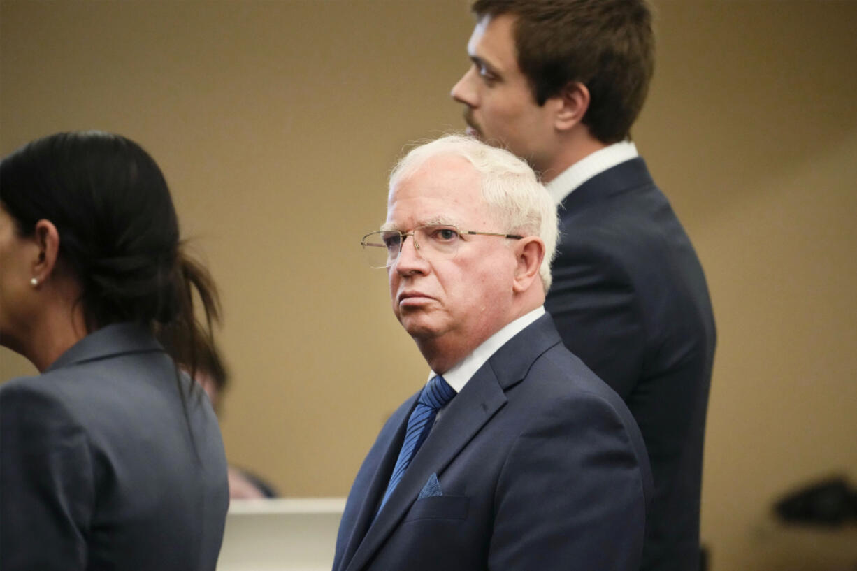 John Eastman, center, appears during his arraignment in Maricopa County Superior, Friday, May 17, 2024, in Phoenix. Eastman pleaded not guilty on Friday to conspiracy, fraud and forgery charges for his role in the effort to overturn Donald Trump&rsquo;s loss in Arizona to Joe Biden in the 2020 election.