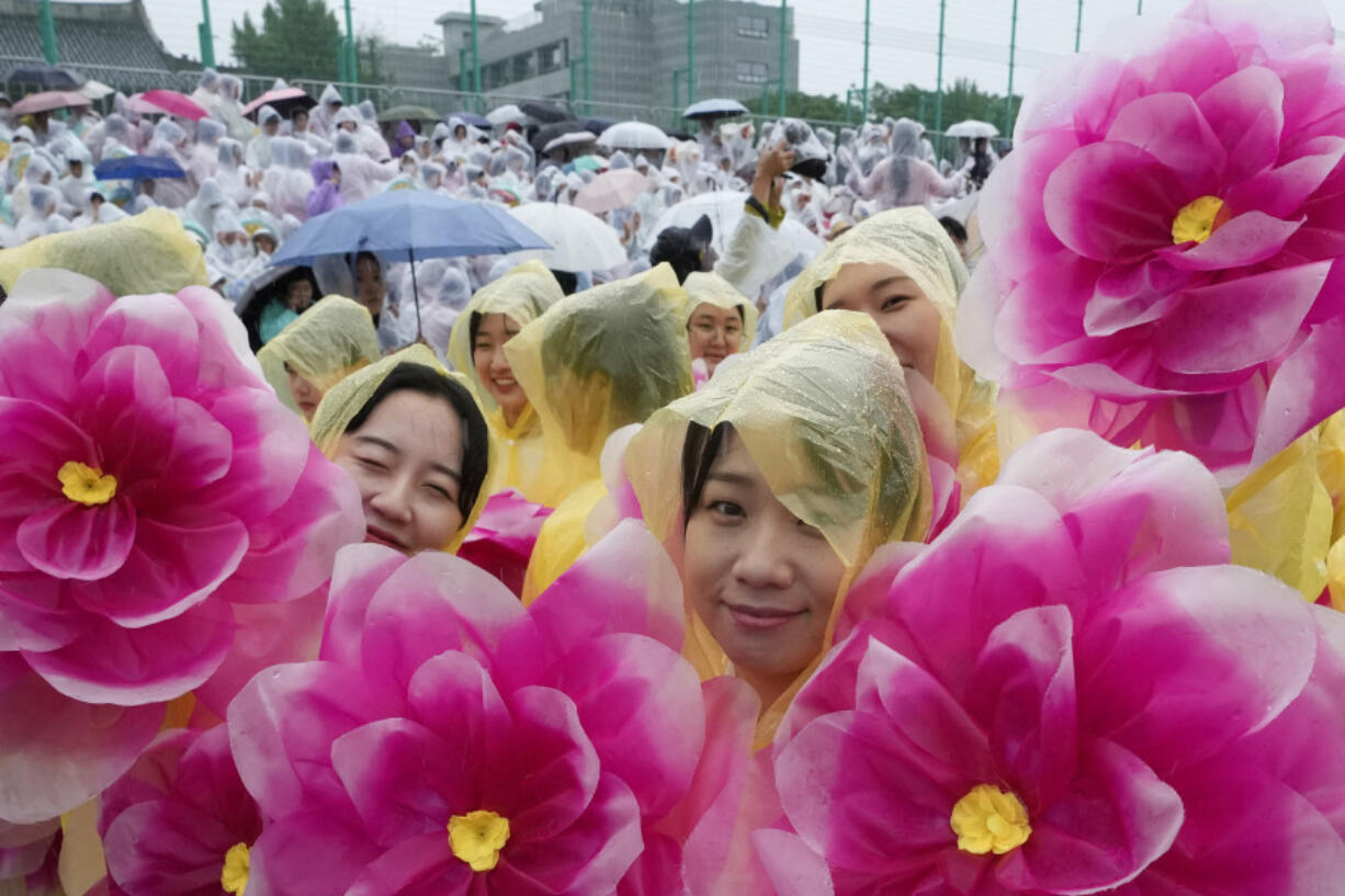 Buddhists wait for the start of a lantern parade as part of festivities celebrating the birthday of Buddha, in Seoul, South Korea, Saturday, May 11, 2024.