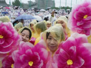 Buddhists wait for the start of a lantern parade as part of festivities celebrating the birthday of Buddha, in Seoul, South Korea, Saturday, May 11, 2024.