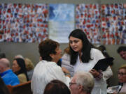 Writer Lulu Fairman, left, talks with writer and co-producer Maryam Chishti before a performance May 22 of &ldquo;What Do I Do With All This Heritage?&rdquo; in Los Angeles.