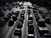 FILE - In this Thursday, April 22, 2021, file photo, cars wait at a red light during rush hour at the Las Vegas Strip, in Las Vegas. A study published Wednesday, May 22, 2024, says U.S. vehicles hit a record average age of 12.6 years in 2024 as people continue to hang on to their rides largely because new ones cost so much.