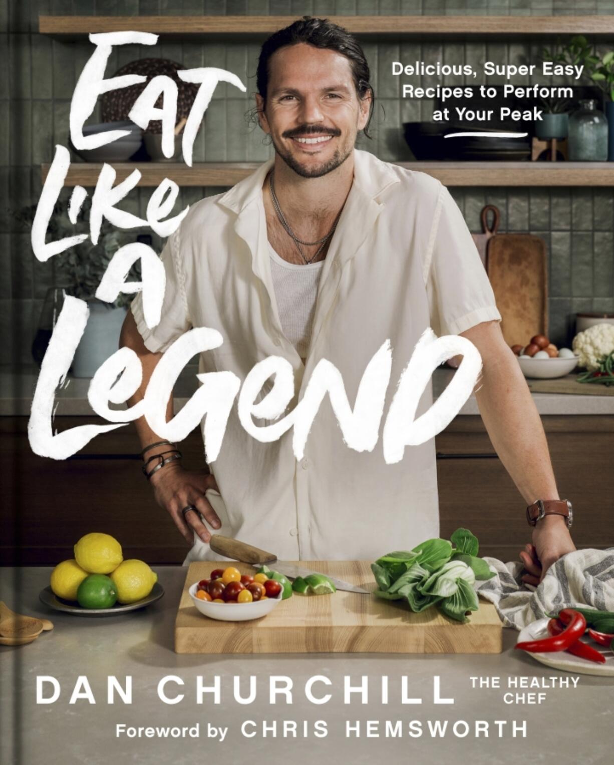 This cover image released by HarperOne shows &ldquo;Eat Like a Legend&rdquo; by Dan Churchill, a chef and performance trainer whose celebrity clients have included Chris Hemsworth. Churchill advises adapting macaroni and cheese to include chopped broccoli and spinach, whole wheat pasta and olive oil instead of the traditional butter.