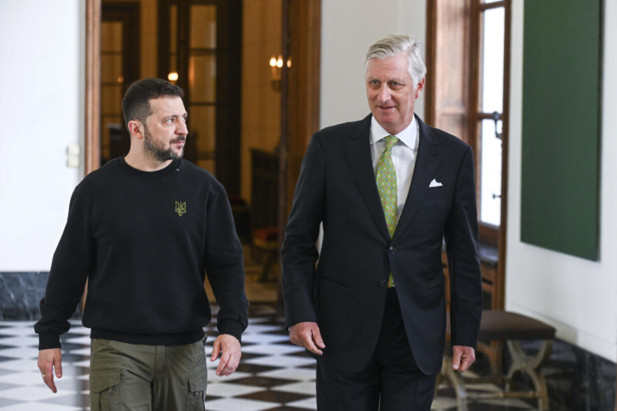 Belgium&rsquo;s King Philippe, right, walks with Ukraine&rsquo;s President Volodymyr Zelenskyy prior to a meeting at the Royal Palace in Brussels, Tuesday, May 28, 2024. President Volodymyr Zelenskyy on Tuesday will get a look at F-16 jets Belgium will send to Ukraine as of later this year and receive more security commitments while European Union defense ministers will again seek to overcome Hungarian objections to send billions of euros in military aid to Kyiv.