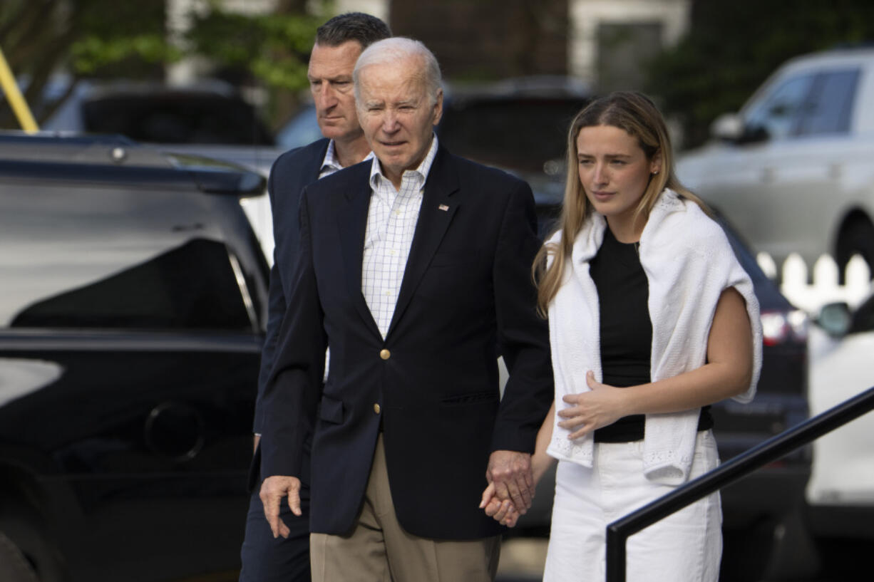 President Joe Biden with granddaughter Finnegan Biden leaves St. Edmond&rsquo;s Roman Catholic Church in Rehoboth Beach, Del., after attending Mass, Sunday, May 12, 2024.