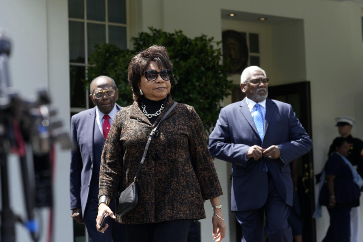 Cheryl Brown Henderson, center, daughter of Brown v. Board of Education named plaintiff Oliver Brown, walks out of the West Wing of the White House in Washington, Thursday, May 16, 2024, to talk with reporters following a meeting with President Joe Biden to mark the 50th anniversary of the historic Supreme Court decision.