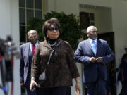 Cheryl Brown Henderson, center, daughter of Brown v. Board of Education named plaintiff Oliver Brown, walks out of the West Wing of the White House in Washington, Thursday, May 16, 2024, to talk with reporters following a meeting with President Joe Biden to mark the 50th anniversary of the historic Supreme Court decision.