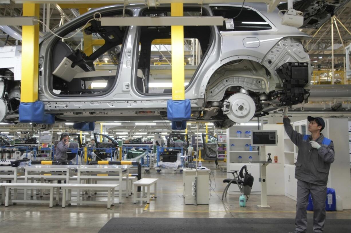 FILE - A worker assembles an SUV at a car plant of Li Auto, a major Chinese EV maker, in Changzhou in eastern China&rsquo;s Jiangsu province on March 27, 2024. The Biden administration is announcing plans to slap new tariffs on Chinese electric vehicles, advanced batteries, solar cells, steel, aluminum and medical equipment.