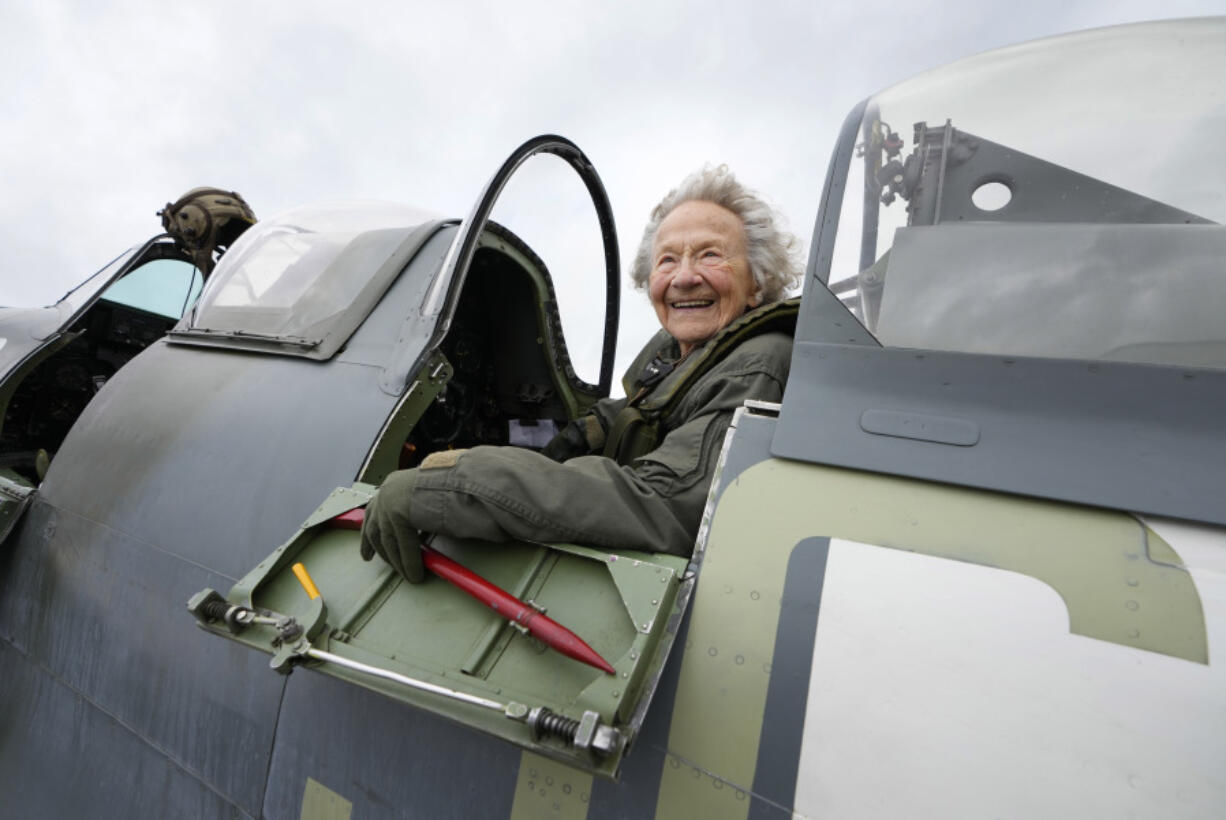 Dorothea Barron 99 years old, who was a serving Wren at the time of D-Day, sits in a Spitfire at Biggin Hill Airport in Kent, England, Tuesday, May 28, 2024. The Taxi Charity for Military Veterans took WWII veterans, including Normandy veterans, to an event at the Biggin Hill Heritage Hangar just ahead of their trip to Normandy for the D Day 80th Anniversary.