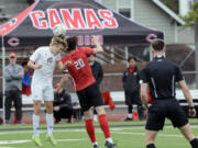 Mount Si's Zach Ramsey (10) and Camas' Owen Tuttle (20) go up to head the ball during the Class 4A boys soccer state championship game on Saturday, May 25, 2024, at Sparks Stadium in Puyallup.