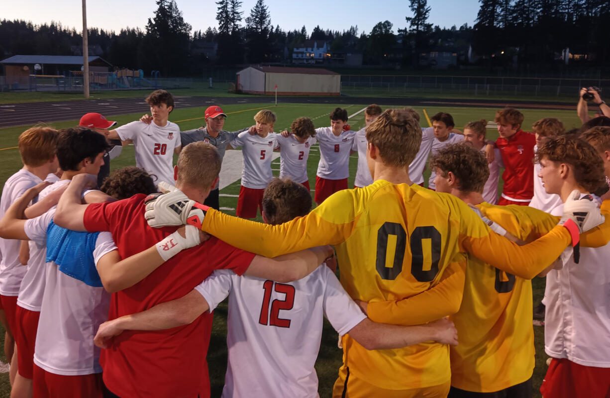The Camas boys soccer team gathers on the field after beating Union 3-2 in 4A bi-district playoff match at Fishback Stadium in Washougal on Thursday, May 8, 2024.