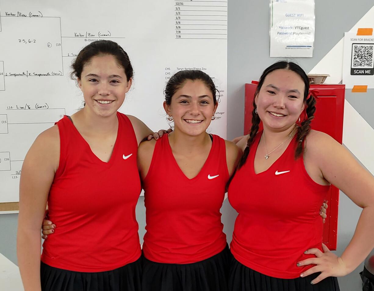 Camas won singles and doubles titles Saturday, May 11, 2024, at Vancouver Tennis Center. Hailey Kerker, center, won the singles title  while Taryn Kerker, left, and Fiona Zou won the doubles.