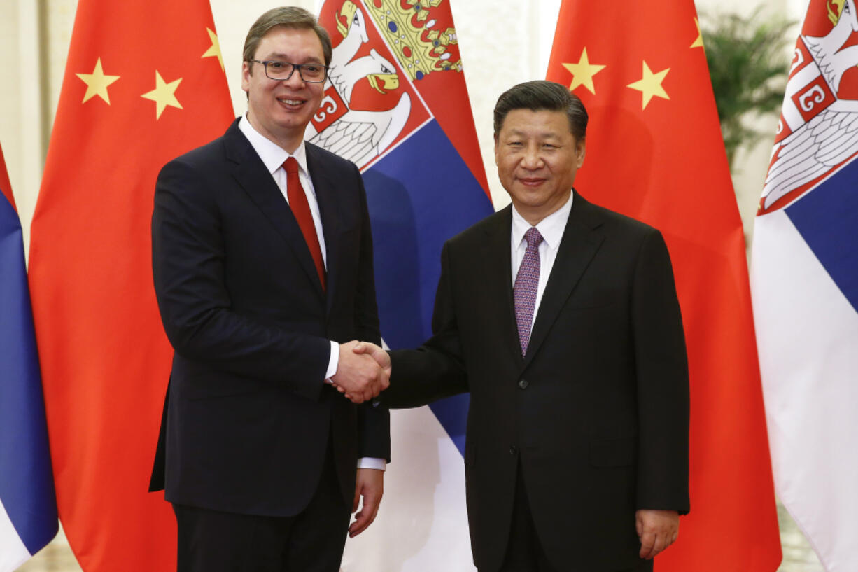 FILE- Serbian Prime Minister Aleksandar Vucic, left, and Chinese President Xi Jinping pose for photographers as they meet at the Great Hall of the People in Beijing Tuesday, May 16, 2017. The two countries have a long history of friendship, particularly since 1999, when NATO bombed the Chinese embassy in Belgrade, killing three Chinese nationals, during the air war to end Serbia&rsquo;s brutal crackdown on ethnic Albanian separatists in Kosovo.