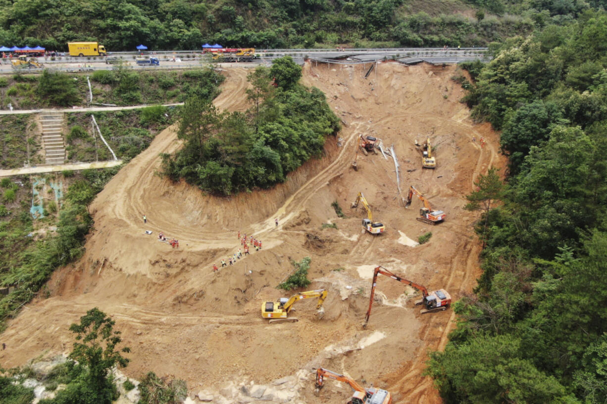 In this photo released by Xinhua News Agency, an aerial drone photo taken on May 2, 2024 shows rescuers and excavators working at the site of a highway section that collapsed on the Meizhou-Dabu Expressway in Meizhou, south China&rsquo;s Guangdong Province. The death toll has climbed as search efforts continue in southern China after a highway section collapsed in a mountainous area, sending more a dozen cars down a steep slope.