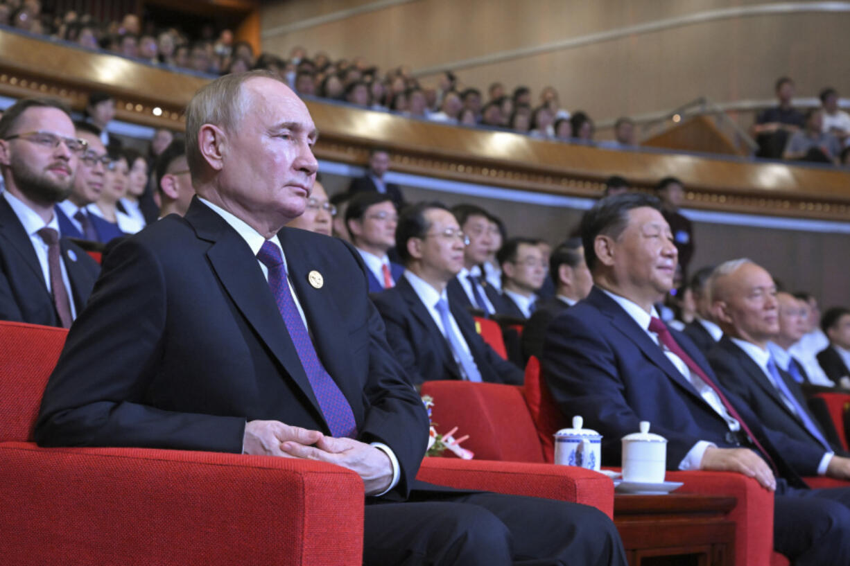 Russian President Vladimir Putin, front left, and Chinese President Xi Jinping, front right, attend a concert marking the 75th anniversary of the establishment of diplomatic relations between Russia and China and opening of China-Russia Years of Culture at the National Centre for the Performing Arts in Beijing, China, on Thursday, May 16, 2024.