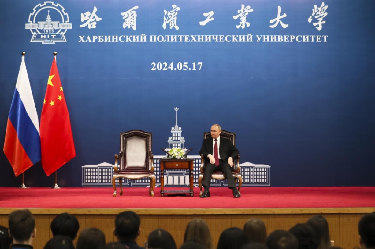 Russian President Vladimir Putin talks with students of the Harbin Institute of Technology in Harbin, northeastern China&rsquo;s Heilongjiang Province, on Friday, May 17, 2024.