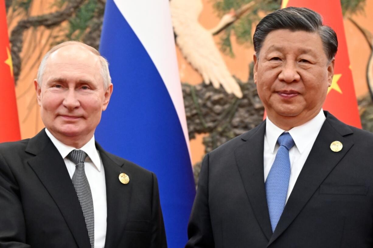 FILE - Chinese President Xi Jinping, right, and Russian President Vladimir Putin pose for a photo prior to their talks on the sidelines of the Belt and Road Forum in Beijing, China, on Wednesday, Oct. 18, 2023.