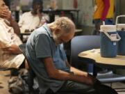 FILE - Patrons try to cool off inside at the Justa Center as temperatures are expected to hit 116 degrees Fahrenheit, on July 18, 2023, in Phoenix. The death certificates of more than 2,300 people who died in the United States last summer mention the effects of excessive heat, the highest number in 45 years of records, according to an Associated Press analysis of Centers for Disease Control and Prevention data. With May already breaking heat records, 2024 could be even deadlier. (AP Photo/Ross D.