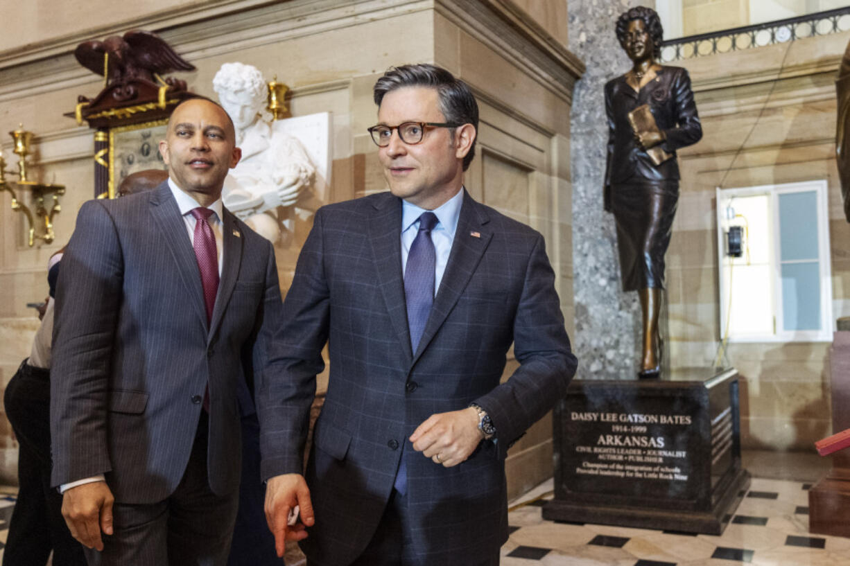 House Minority Leader Hakeem Jeffries, left, and House Speaker Mike Johnson, of Louisiana, attend a statue unveiling ceremony of Daisy Bates, of Arkansas, Wednesday, May 8, 2024, at Statuary Hall on Capitol Hill in Washington.