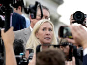 Rep. Marjorie Taylor Greene, R-Ga., speaks to reporters after she tried and failed to oust Speaker Mike Johnson, her long-shot effort swiftly and resoundingly rejected by Democrats and Republicans tired of the political chaos, at the Capitol in Washington, Wednesday, May 8, 2024. (AP Photo/J.