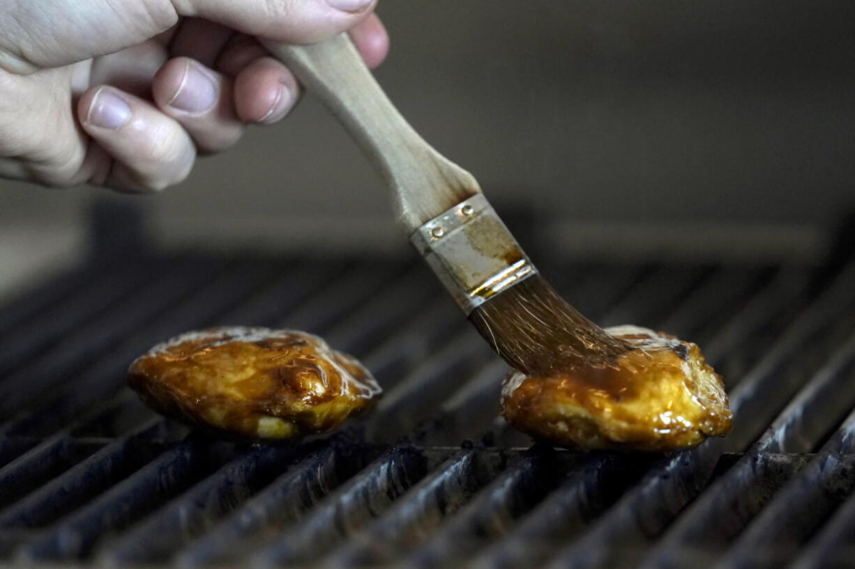 Chef Zach Tyndall prepares Good Meat&rsquo;s cultivated chicken June 14 at the Eat Just office in Alameda, Calif.