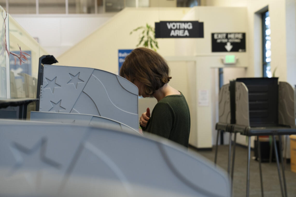 A person votes during primary voting at the Multnomah County elections office on Tuesday, May 21, 2024, in Portland, Ore.