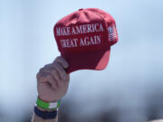 FILE - An attendee waves a hat ahead of a campaign rally for Republican presidential candidate former President Donald Trump in Wildwood, N.J., on May 11, 2024. Trump&rsquo;s presidential campaign will begin accepting donations in cryptocurrency, the presumptive Republican presidential nominee&rsquo;s campaign says.