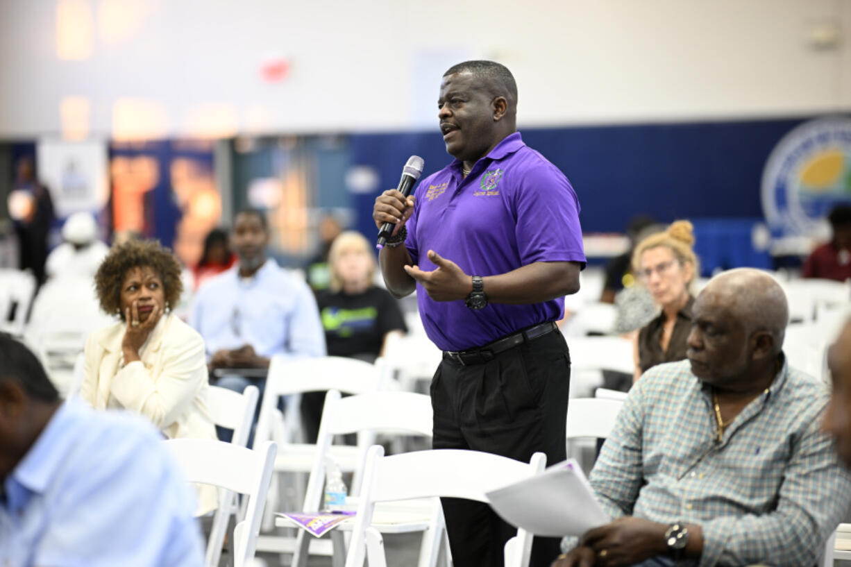 Kelvin G. Mayner asks a question during the Voters Education 2024 Community Forum, addressing the Florida Legislature&rsquo;s voter suppression tactics, Thursday, May 16, 2024, in Daytona Beach, Fla. Laws passed in several Republican-controlled states are making it challenging for advocates to adapt as they try to register and educate potential voters with just months to go before the presidential election.  (AP Photo/Phelan M.