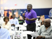 Kelvin G. Mayner asks a question during the Voters Education 2024 Community Forum, addressing the Florida Legislature&rsquo;s voter suppression tactics, Thursday, May 16, 2024, in Daytona Beach, Fla. Laws passed in several Republican-controlled states are making it challenging for advocates to adapt as they try to register and educate potential voters with just months to go before the presidential election.  (AP Photo/Phelan M.