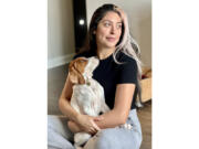 Kristie Pereira and her dog, Beau, pose for a photo in Laurel, Md., in January 2023. Pereira is seeking answers after the sick dog she took to a shelter to have euthanized turned up more than a year later on a rescue adoption site.