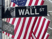 American flags fly on the front of the New York Stock Exchange near the intersection of Broad and Wall Streets on Wednesday, May 22, 2024, in New York. Markets on Wall Street were mixed early Wednesday but remain at or above record levels as more results from retailers take center stage amid a dearth of economic news.