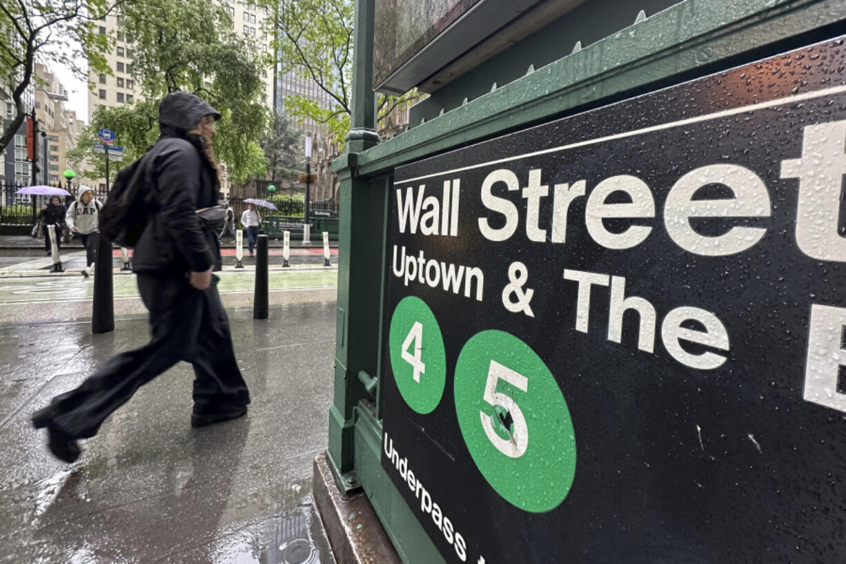 A person passes an entrance to the Wall Street subway station in New York on Wednesday, May 15, 2024. Trading on Wall Street is muted early ahead of the U.S. government&rsquo;s latest reports on inflation and retail sales.