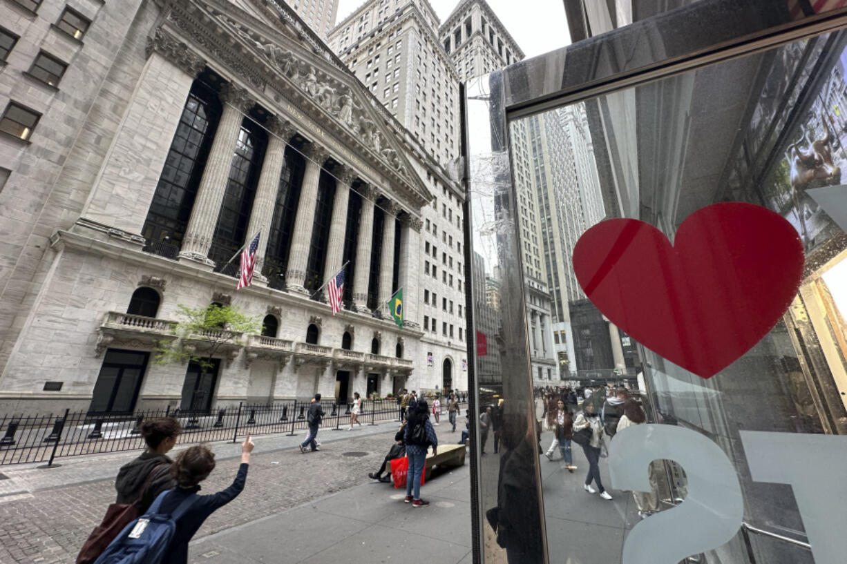 A heart is displayed on the door of a gift shop across from the New York Stock Exchange on Thursday, May 16, 2024, in New York. The Dow Jones Industrial Average briefly topped the 40,000 level on Thursday for the first time but ended 0.1% lower.