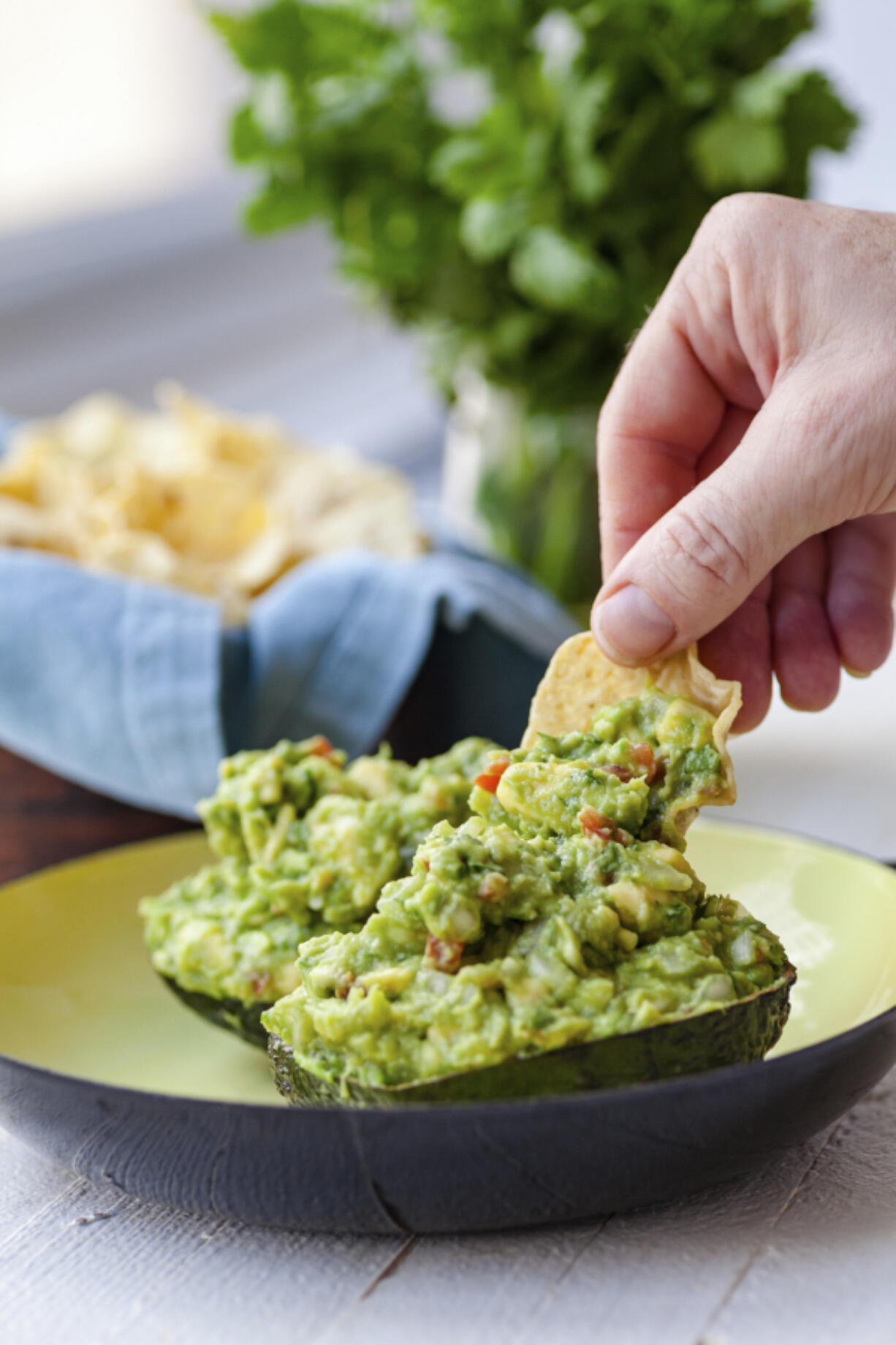 A recipe for guacamole, served in an avocado shell, appears in New York in June 2019.