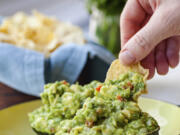 A recipe for guacamole, served in an avocado shell, appears in New York in June 2019.