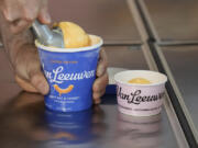 Ben Van Leeuwen scoops Kraft Mac &amp; Cheese flavored ice cream Wednesday in the Brooklyn borough of New York.