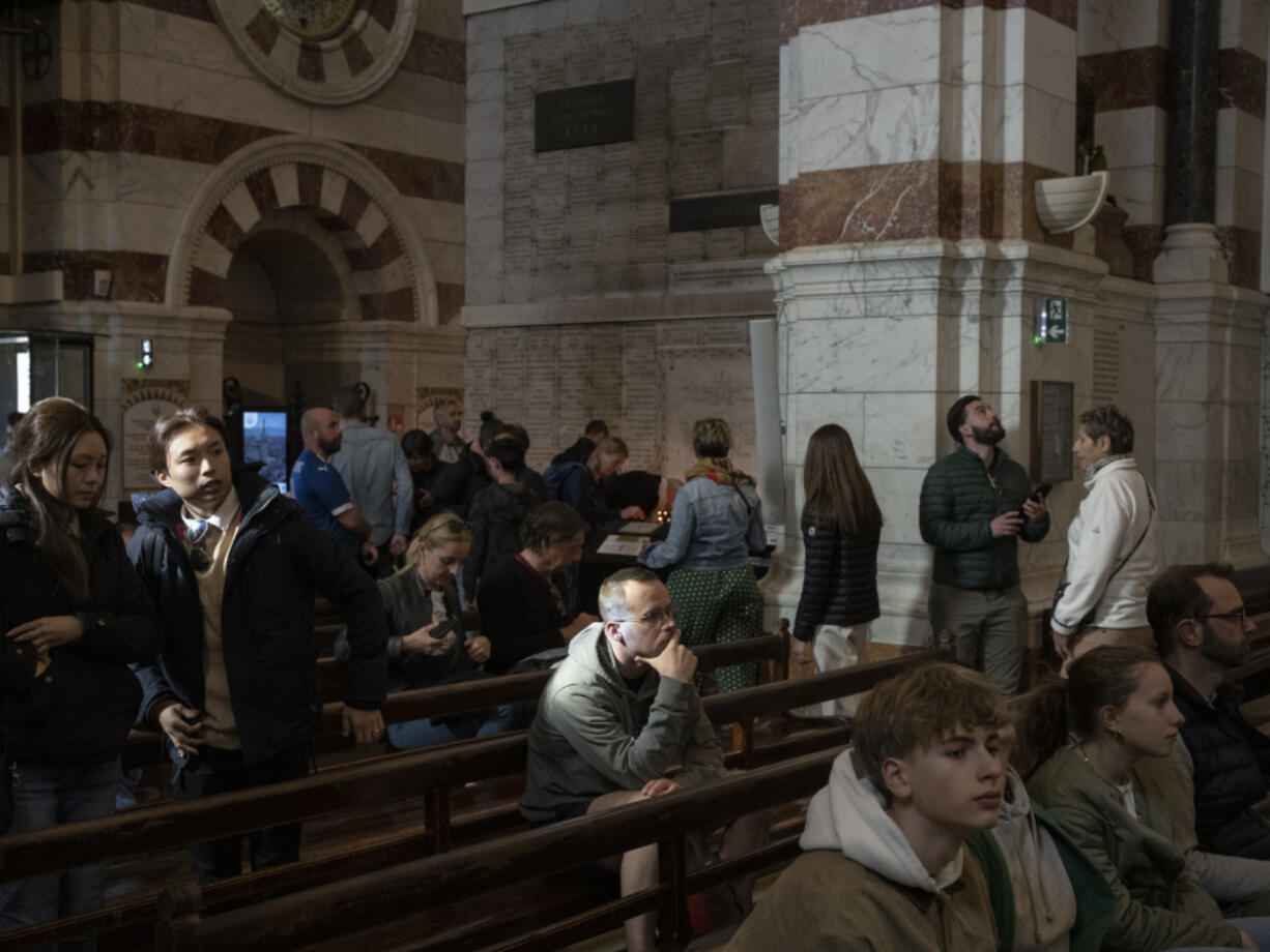 People visit the Notre Dame de la Garde Basilica on April 19 in Marseille, southern France.